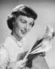 Close-up of a young woman reading a newspaper Poster Print - Item # VARSAL25522260 Close-up of a young woman reading a newspaper Poster Print - Item # VARSAL25522260