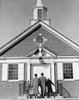 Parents with children in front of church Poster Print - Item # VARSAL255421837