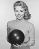 Young woman holding a bowling ball and smiling Poster Print - Item # VARSAL2558882A