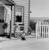 Grandmother and grandson sitting outside house Poster Print - Item # VARSAL255424924