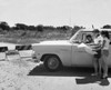 Mother and daughter looking at map near closed road sign Poster Print - Item # VARSAL2558460