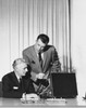 Two businessmen talking in an office Poster Print - Item # VARSAL25548391