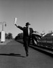 Man with suitcases running along railroad track Poster Print - Item # VARSAL255422145