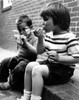Two boys sitting on curb blowing bubbles Poster Print - Item # VARSAL2554686