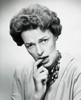 Portrait of a mid adult woman biting her finger Poster Print - Item # VARSAL25511513A