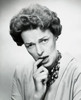 Portrait of a mid adult woman biting her finger Poster Print - Item # VARSAL25511513A
