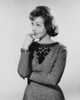 Close-up of a young woman biting her fingernails Poster Print - Item # VARSAL25541839