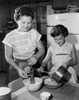 Daughter helping her mother in the kitchen Poster Print - Item # VARSAL2552305