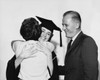 Female graduate hugging a woman with a mature man standing beside her Poster Print - Item # VARSAL25518858