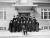 College students dressed in graduation gowns standing in front of the school library Poster Print - Item # VARSAL25516803