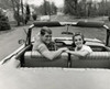 Portrait of a young couple sitting in a convertible car Poster Print - Item # VARSAL2556408B