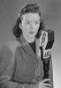 Studio portrait of female reporter speaking into microphone Poster Print - Item # VARSAL255422868