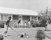 Teenage boy mowing the grass with a lawn mower Poster Print - Item # VARSAL25532190
