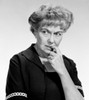 Worried mature woman biting her fingernail and looking away  studio shot Poster Print - Item # VARSAL255417797