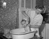 Young woman bathing baby Poster Print - Item # VARSAL2559884B