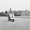 Young man driving scooter Poster Print - Item # VARSAL255417804