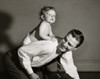 Side profile of a son riding on his father's back Poster Print - Item # VARSAL2559776