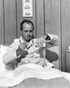 Mature man in bed pouring medicine into a spoon Poster Print - Item # VARSAL25534830