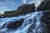 A small waterfall flows into the ocean along the eastern coast of Iceland; Iceland PosterPrint - Item # VARDPI12296400