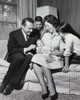Parents and their children sitting on a couch Poster Print - Item # VARSAL25518625