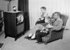 Father and two sons watching television Poster Print - Item # VARSAL255420109