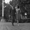 Young couple walking on sidewalk Poster Print - Item # VARSAL255420789