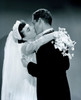 Groom kissing bride holding bouquet Poster Print - Item # VARSAL255417259