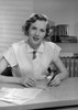 Portrait of woman sitting in office Poster Print - Item # VARSAL25548455