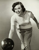 Young adult woman rolling a bowling ball Poster Print - Item # VARSAL2553694