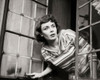 Close-up of a young woman peeking through a window Poster Print - Item # VARSAL2557043