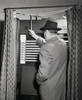 Rear view of a senior man standing in a voting booth Poster Print - Item # VARSAL25518764