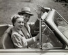 Portrait of a young couple sitting in a convertible car Poster Print - Item # VARSAL2552941