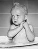 Baby in a bathtub Poster Print