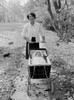 Mother walking with baby in baby carriage Poster Print - Item # VARSAL2559751