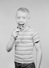 Studio portrait of boy eating ice cream Poster Print - Item # VARSAL255422170