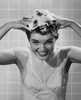 Young woman shampooing her hair Poster Print - Item # VARSAL25542438