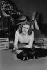 Studio portrait of young woman with records. Poster Print - Item # VARSAL255422889