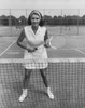 Young woman standing on a tennis court and holding a tennis racket Poster Print - Item # VARSAL25524201