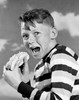 Portrait of boy eating hot dog Poster Print - Item # VARSAL255417492