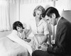 Male doctor writing a prescription for a female patient Poster Print - Item # VARSAL2553534B