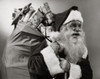 Side profile of Santa Claus carrying a sack of Christmas presents on his back Poster Print - Item # VARSAL2553522