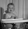Baby sitting in high chair sticking out tongue Poster Print - Item # VARSAL2559682A