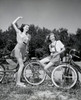 Two teenage girls with bicycles Poster Print - Item # VARSAL2553906