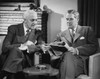Two businessmen reading a magazine Poster Print - Item # VARSAL25528049