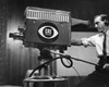 Side profile of a cameraman shooting in a television studio Poster Print - Item # VARSAL2556921