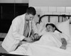 Doctor taking woman's pulse Poster Print - Item # VARSAL255419281