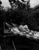 Mature man relaxing in hammock and listening radio Poster Print - Item # VARSAL25549045