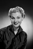 Portrait of young woman smiling  studio shot Poster Print - Item # VARSAL255416928