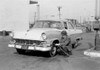 Man putting air in tire Poster Print - Item # VARSAL255419183