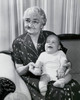 Close-up of a grandmother sitting on a couch with her grandson on her lap Poster Print - Item # VARSAL25520073